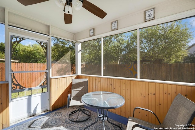 sunroom with ceiling fan and a healthy amount of sunlight