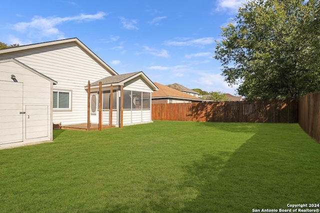 view of yard with a sunroom