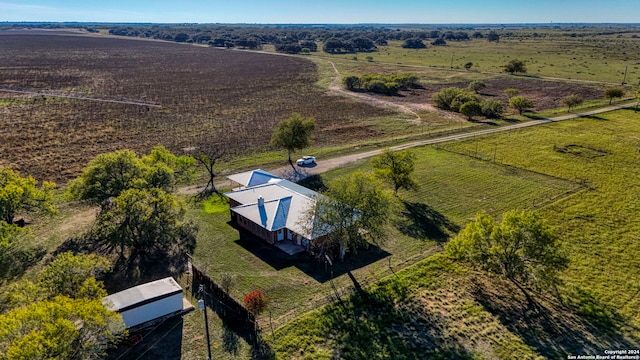 birds eye view of property with a rural view