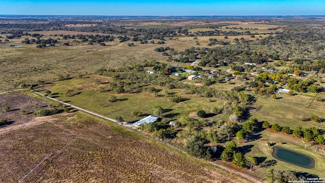 aerial view with a rural view and a water view