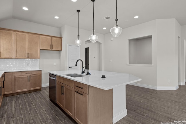 kitchen featuring a center island with sink, decorative light fixtures, stainless steel dishwasher, and sink