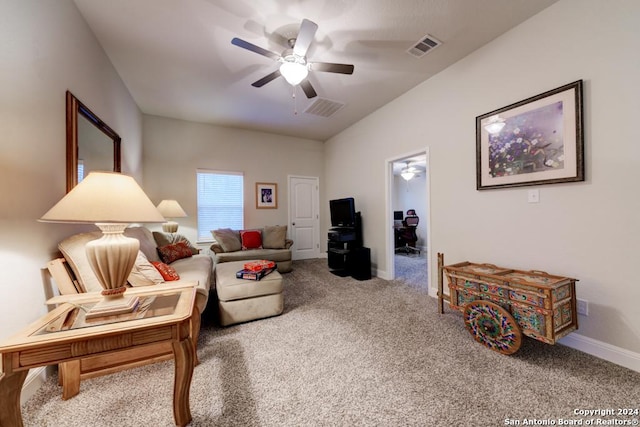 living room featuring carpet and ceiling fan