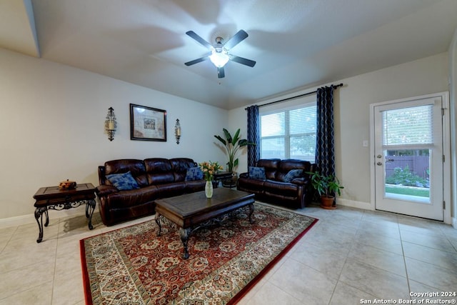 living room featuring ceiling fan and light tile patterned floors