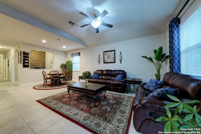 tiled living room featuring ceiling fan