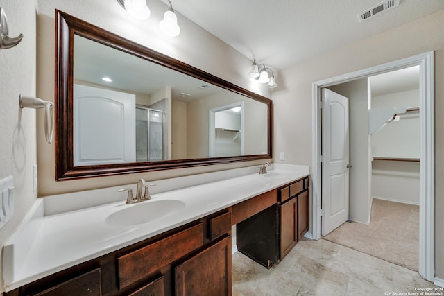 bathroom featuring vanity and walk in shower