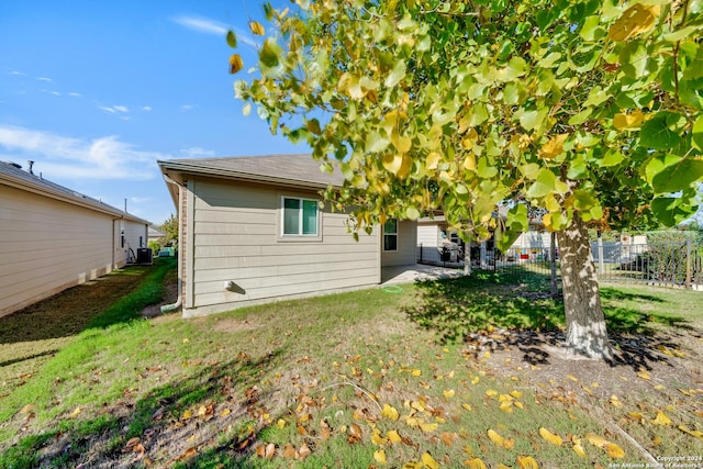 back of property featuring a patio and a lawn