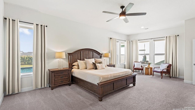 carpeted bedroom featuring ceiling fan