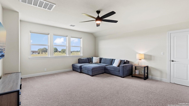 carpeted living room featuring ceiling fan and lofted ceiling