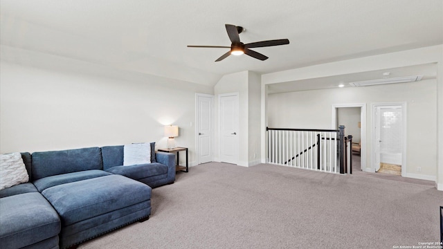 interior space with ceiling fan, carpet floors, and lofted ceiling