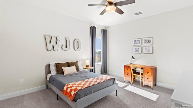 bedroom with ceiling fan and light colored carpet