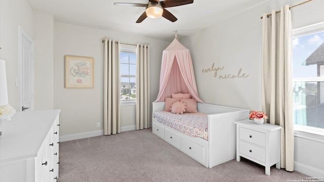 bedroom with light carpet and ceiling fan