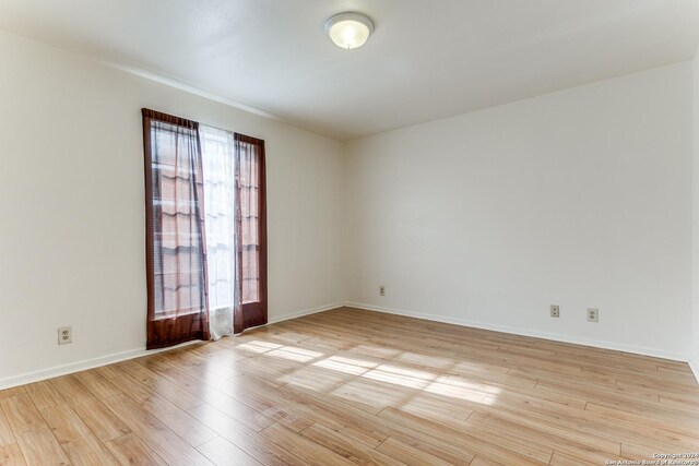 unfurnished room featuring light wood-type flooring