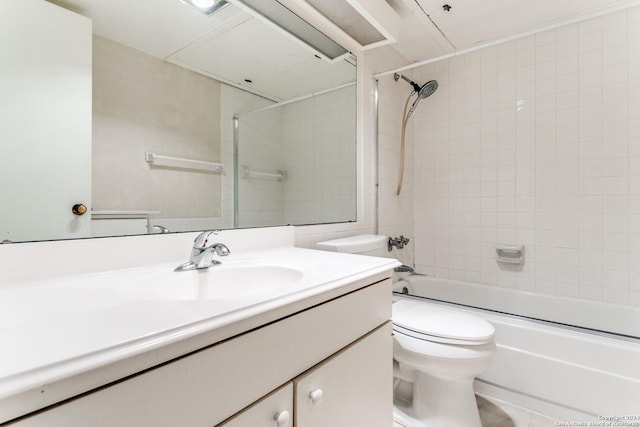 full bathroom with vanity, toilet, and tiled shower / bath