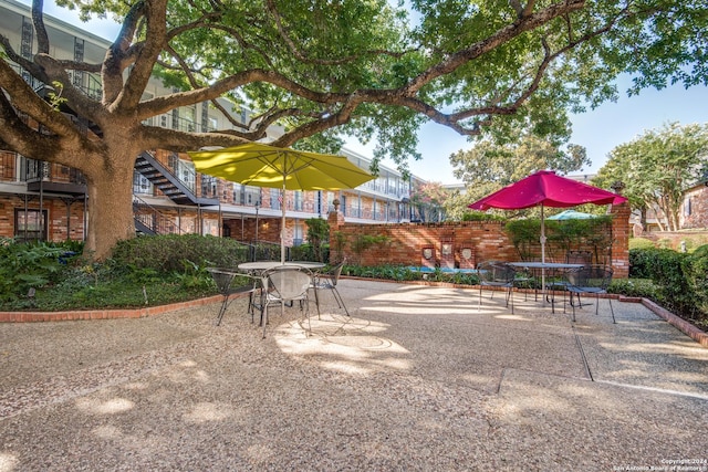 surrounding community featuring a patio area