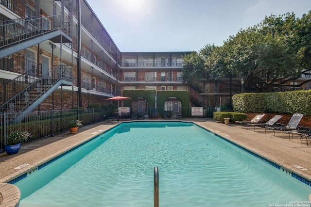 view of swimming pool with a patio