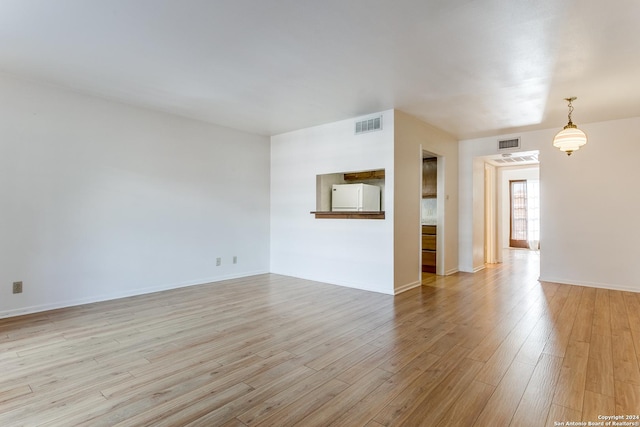 empty room with light wood-type flooring