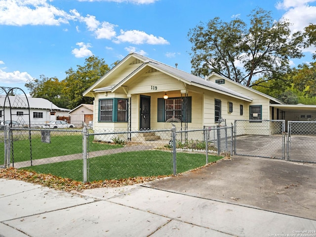 bungalow-style home with a front lawn and a porch