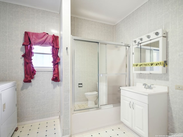 full bathroom with combined bath / shower with glass door, vanity, tile walls, and ornamental molding