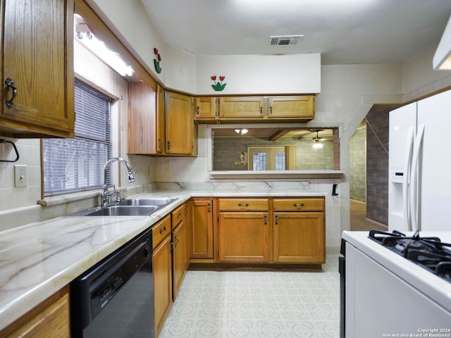 kitchen featuring ceiling fan, decorative backsplash, white appliances, and sink