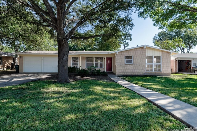 ranch-style home featuring a front yard and a garage