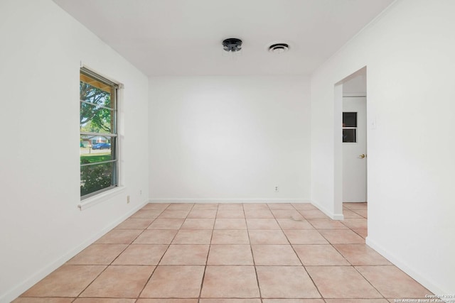 empty room with light tile patterned floors