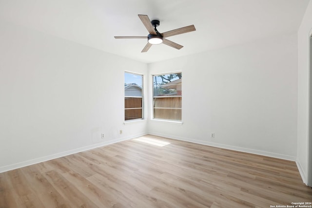 spare room with ceiling fan and light hardwood / wood-style flooring