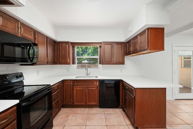 kitchen with black appliances, light tile patterned flooring, kitchen peninsula, and sink