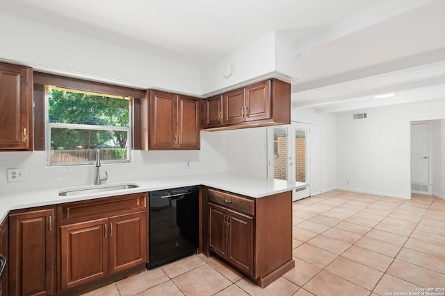 kitchen with dishwasher, backsplash, sink, light tile patterned floors, and kitchen peninsula