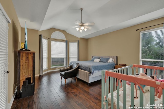 bedroom featuring dark hardwood / wood-style flooring, ceiling fan, and lofted ceiling