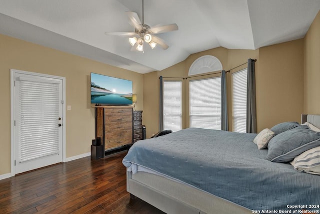 bedroom with ceiling fan, dark hardwood / wood-style flooring, and vaulted ceiling