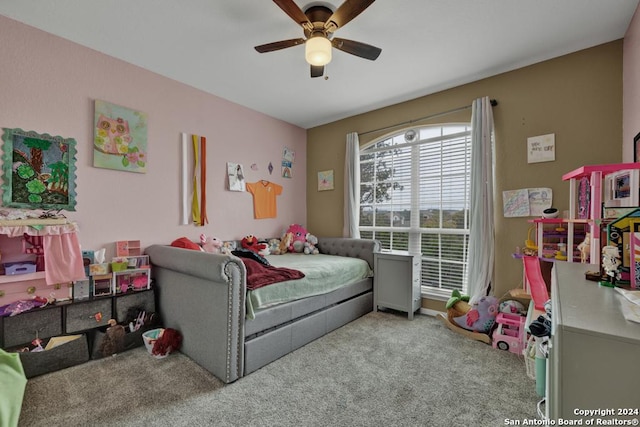 bedroom with ceiling fan and light carpet