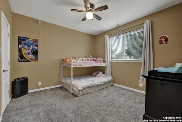 bedroom featuring light colored carpet and ceiling fan