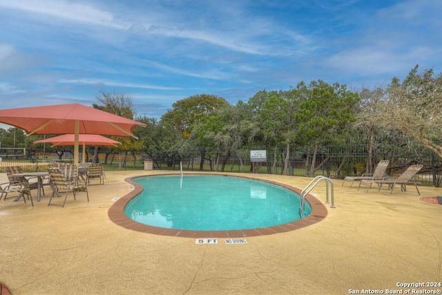 view of pool featuring a patio