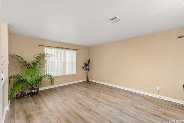 unfurnished room featuring light hardwood / wood-style flooring