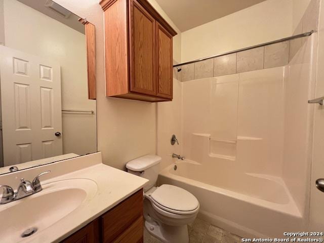 full bathroom with toilet, vanity, and bathing tub / shower combination