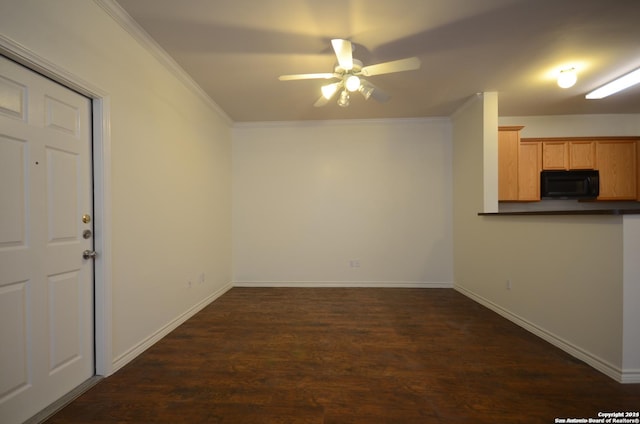 interior space with dark hardwood / wood-style floors, ceiling fan, and ornamental molding