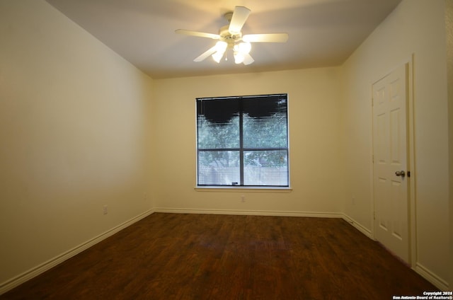 unfurnished room featuring dark hardwood / wood-style floors and ceiling fan