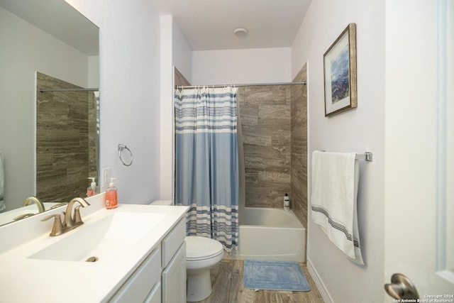 full bathroom featuring shower / bath combo with shower curtain, vanity, wood-type flooring, and toilet