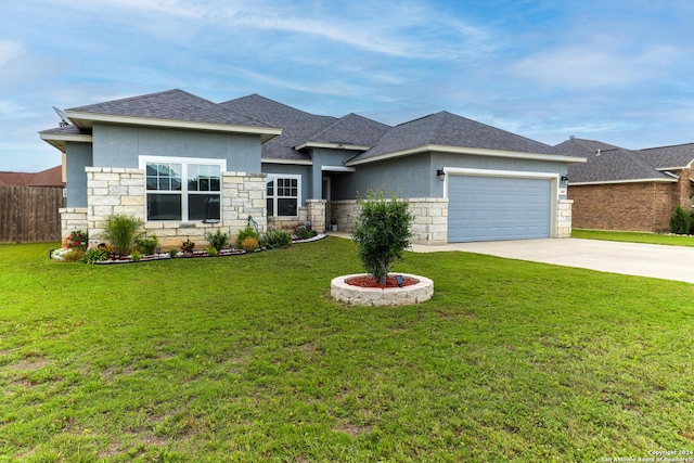 view of front facade featuring a front yard and a garage