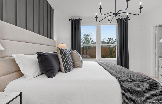 4076 Paddock Trl, Seguin, TX 78155 - bedroom featuring a chandelier