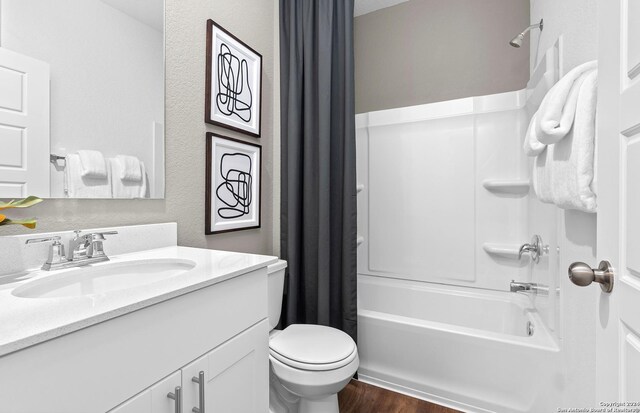 4076 Paddock Trl, Seguin, TX 78155 - full bathroom with vanity, shower / bath combination with curtain, wood finished floors, and a textured wall