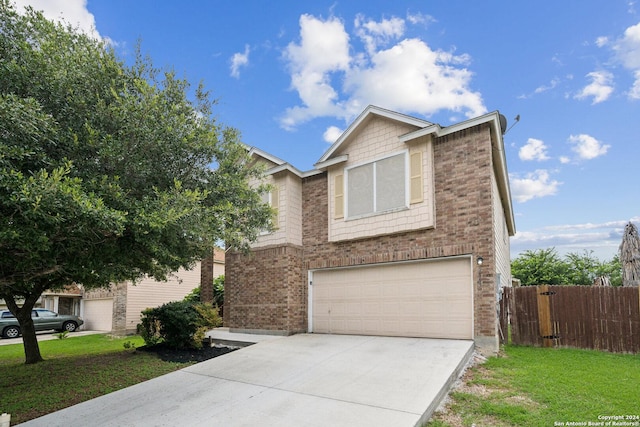 view of front of home with a front lawn and a garage