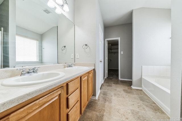 bathroom featuring a bathing tub and vanity