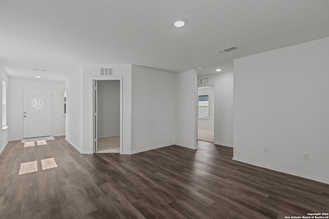 interior space with dark hardwood / wood-style flooring