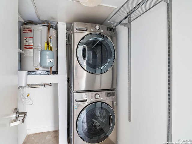 laundry area featuring stacked washer and clothes dryer and water heater