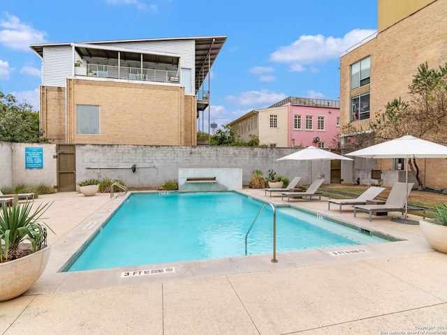 view of swimming pool with a patio