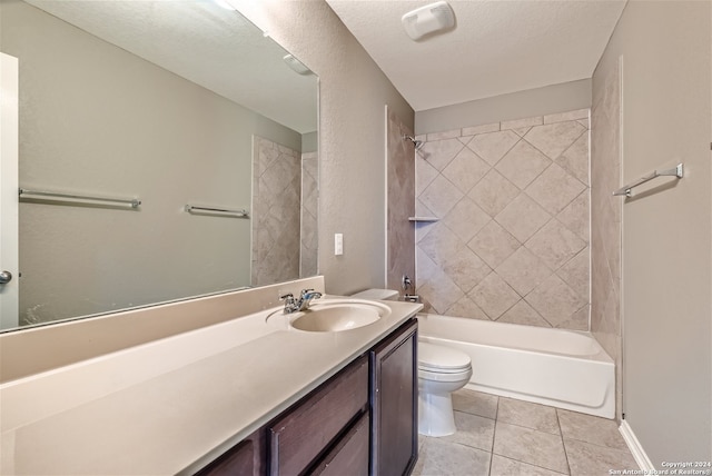 full bathroom with tiled shower / bath combo, tile patterned flooring, a textured ceiling, toilet, and vanity