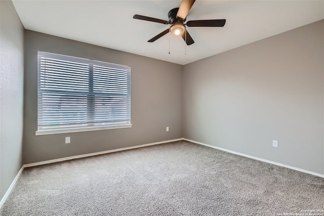 carpeted empty room with ceiling fan