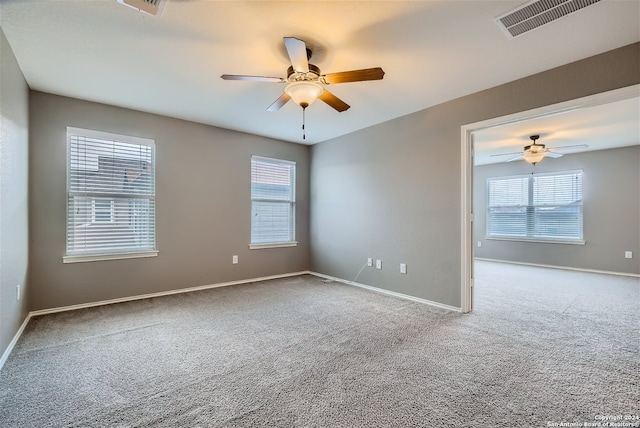 carpeted empty room with ceiling fan