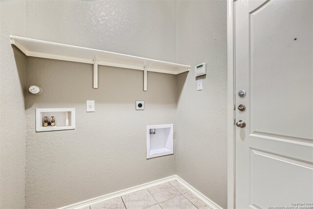 laundry area featuring electric dryer hookup, hookup for a washing machine, and light tile patterned flooring